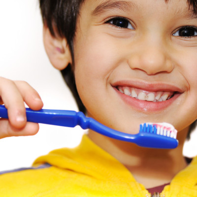 Little boy brushes her teeth